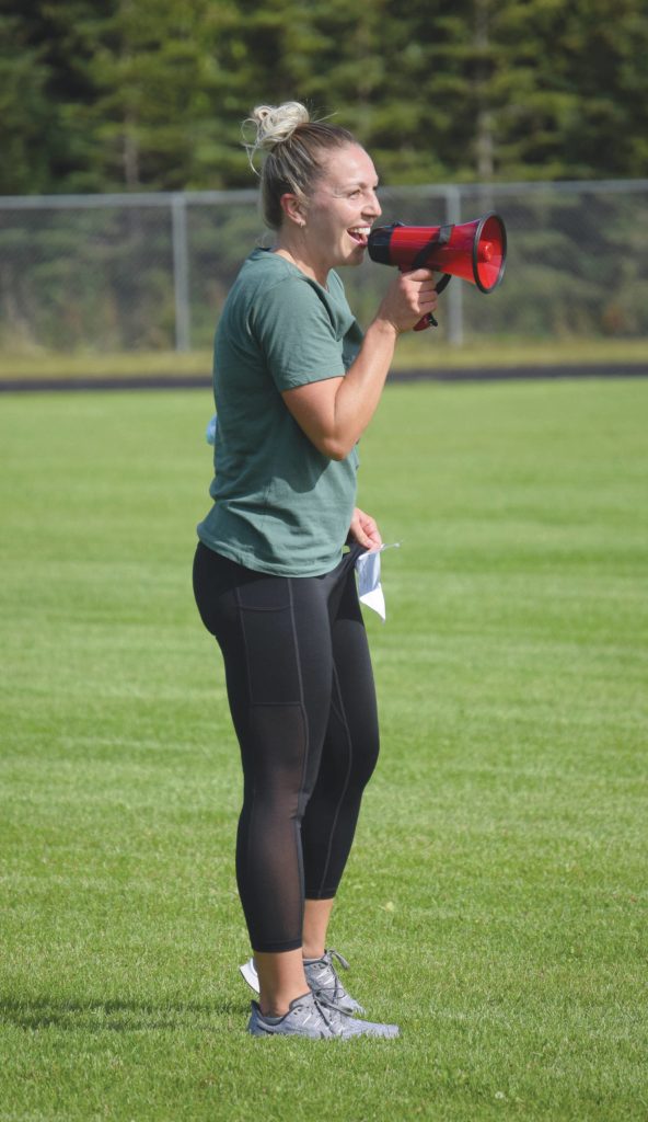 Nikiski volleyball coach Stacey Segura leads a workout Thursday, Aug. 27, 2020, at the football field at Nikiski High School in Nikiski, Alaska. (Photo by Jeff Helminiak/Peninsula Clarion)