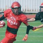 Jeff Helminiak / Peninsula Clarion                                Luke Armstrong and James Sparks practice punt return and coverage Monday at Ed Hollier Field at Kenai Central High School.