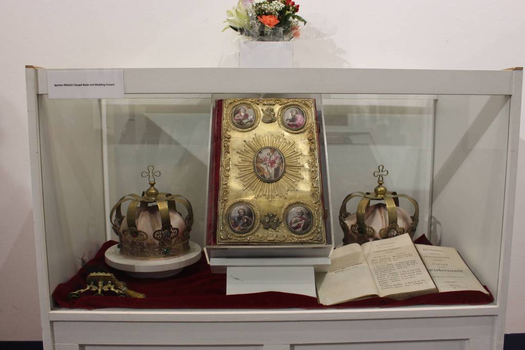 The original Bible and marriage crowns of Igumen Nikolai, who traveled to the Kenai Peninsula in the late 1800s, are seen here on display at the Kenai Visitor and Cultural Center on Sept. 4, 2020. (Photo by Brian Mazurek/Peninsula Clarion)