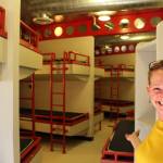Marnie Alcott, the CEO of the Challenger Learning Center in Kenai, Alaska, shows one of the dormitories at the center that could be used as an emergency cold weather shelter this winter on Sept. 10, 2020. (Photo by Brian Mazurek/Peninsula Clarion)