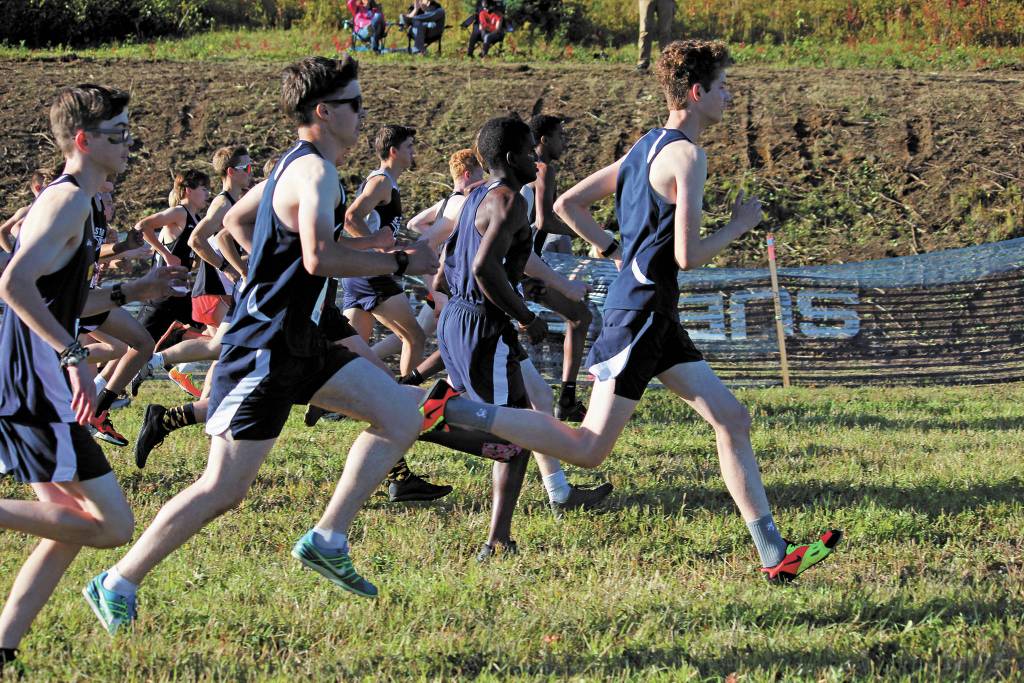 Homers Seamus McDonough leads the pack out of the mass start of the boys varsity 5 kilometer race Friday, Sept. 11, 2020 at the Lookout Mountain Trails near Homer, Alaska. (Photo by Megan Pacer/Homer News)