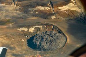 This Aug. 20, 2010 photo provided by the U.S. Geological Survey shows the lava dome named Novarupta marks the 1.2 mile (2 km) wide vent of the 1912 Novarupta-Katmai eruption. While western U.S. states were suffering from hazy red skies from wildfires, Alaska was dealing with an air quality problem born a century ago. Strong southerly winds picked up loose ash from a 1912 volcanic eruption, sending an ash cloud about 4,000 feet into the sky. (Peter Kelly/U.S. Geological Survey via AP)