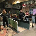 The cast and crew of Knife Skills poses for a photo at Pier One Theatre during a recording session in August in Homer, Alaska. From left to right are Peter Sheppard, Theodore Castellani, Chloë Pleznac, Joshua Krohn (sitting, at sound board), Darrel Oliver, Helen-Thea Marcus and Ingrid Harrald. (Photo courtesy of Lindsey Schneider)