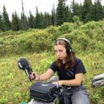 Lindsey Schneider records nature sounds for her radio play, Knife Skills, in August 2020 in Homer, Alaska. (Photo courtesy of Lindsey Schneider)