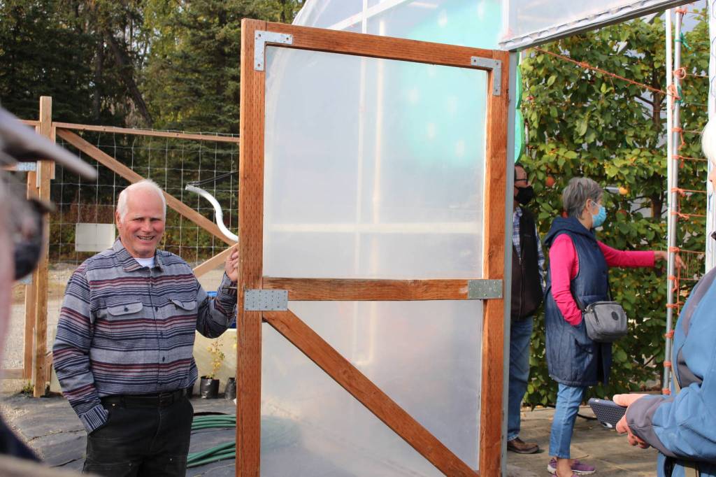 Mike OBrien, owner of OBrien Garden and Trees, leads a tour through the high tunnels during the annual apple tasting in Nikiski, Alaska on Sept. 19, 2020. (Photo by Brian Mazurek/Peninsula Clarion)