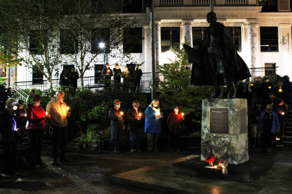Ben Hohenstatt / Juneau Empire                                Juneauites hold a vigil Saturday commemorating the death of Supreme Court Justice Ruth Bader Ginsburg around the statue of William Seward in Dimond Courthouse Plaza. The vacancy left on the Supreme Court by Ginsburgs death has already caused partisan battles in Washington.