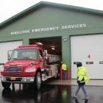 Ninilchik Fire Chief David Bear moves the fire truck out of the new Ninilchik Emergency Services building on Aug. 9, 2014, to make room for visitors to the open house of the new NES building. (Homer News file photo)