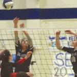 Soldotnas Sierra Kuntz and Bethany Richmond put up a block on Kenai Centrals Andie Galloway on Friday, Sept. 25, 2020, at Soldotna High School in Soldotna, Alaska. (Photo by Jeff Helminiak/Peninsula Clarion)