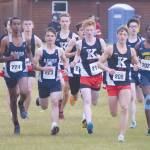 Kenai Centrals Maison Dunham (209) takes the lead at the start en route to victory in the Kenai Peninsula Borough cross-country race Saturday, Sept. 26, 2020, at Tsalteshi Trails just outside of Soldotna, Alaska. (Photo by Jeff Helminiak/Peninsula Clarion)