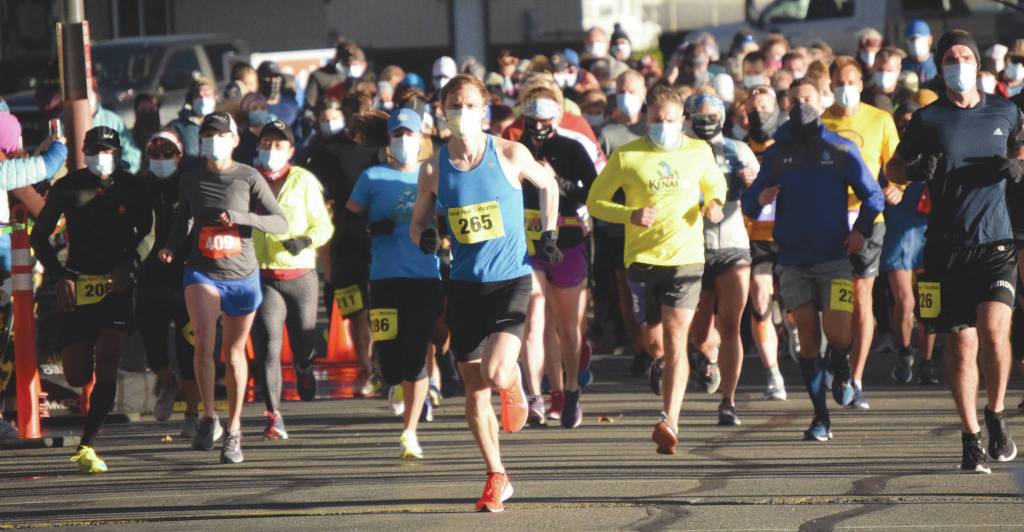 Soldotnas Jason Parks, half marathon winner, leads the pack of marathon and half marathon racers from the start Sunday, Sept. 27, 2020, at the Kenai River Marathon in Kenai, Alaska. (Photo by Jeff Helminiak/Peninsula Clarion)