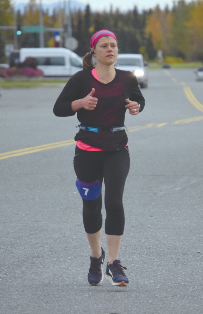 Homers Stacey Buckelew runs to victory in the Kenai River Marathon on Sunday, Sept. 27, 2020, in Kenai, Alaska. (Photo by Jeff Helminiak/Peninsula Clarion)