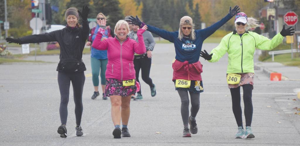 Ninilchiks Elise Spofford supports Anchorages Julie Jokinen, Anchorages Sara Peebles and Soldotnas Debra Hart in the half marathon at the Kenai River Marathon in Kenai, Alaska, on Saturday, Sept. 27, 2020. (Photo by Jeff Helminiak/Peninsula Clarion)