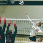 Nikiskis Lillian Carstens attacks Kenai Centrals Abby Every and Kaylee Lauritsen on Tuesday, Sept. 29, 2020, at Nikiski High School in Nikiski, Alaska. (Photo by Jeff Helminiak/Peninsula Clarion)