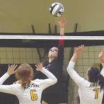 Kenai Centrals Andie Galloway tips on Nikiskis Alyssa Nunley and Emma Lakin on Tuesday, Sept. 29, 2020, at Nikiski High School in Nikiski, Alaska. (Photo by Jeff Helminiak/Peninsula Clarion)