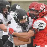 Nikiski running back Jaryn Zoda is stood up by Kenai Centrals Tucker Vann on Friday, Oct. 2, 2020, at Kenai Central High School in Kenai, Alaska. (Photo by Jeff Helminiak/Peninsula Clarion)