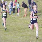 Homers Eryn Field outsprints Sewards Maranatha Brueckner to the finish at the Region III/Southern Division meet Saturday, Oct. 3, 2020, at Tsalteshi Trails near Soldotna, Alaska. (Photo by Jeff Helminiak/Peninsula Clarion)