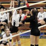 Homers Gracie Gummer and Kenais Erin Koziczkowski meet across the net during a Tuesday, Oct. 6, 2020 volleyball game in the Alice Witte Gymnasium in Homer, Alaska. (Photo by Megan Pacer/Homer News)