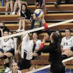 Homers Gracie Gummer and Kenais Erin Koziczkowski meet across the net during a Tuesday, Oct. 6, 2020 volleyball game in the Alice Witte Gymnasium in Homer, Alaska. (Photo by Megan Pacer/Homer News)