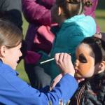 Children get their face painted Saturday, Oct. 12, 2019, at the fourth annual Fall Pumpkin Festival at Millenium Square in Kenai, Alaska. (Photo by Joey Klecka/Peninsula Clarion)