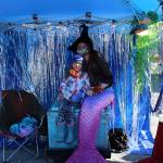 Ashlynn Marie Parrott takes a photo with AnneMeridia, the Kenai Rivers resident mermaid, during the 5th annual Kenai Fall Pumpkin Festival in Kenai, Alaska on Oct. 10, 2020. (Photo by Brian Mazurek/Peninsula Clarion)