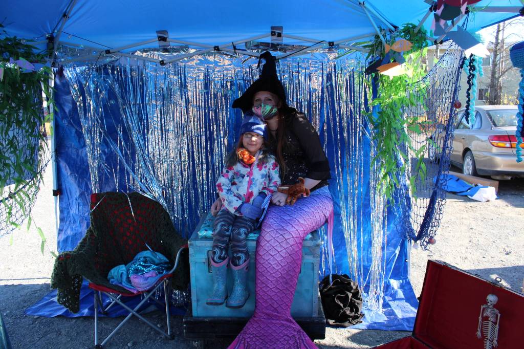 Ashlynn Marie Parrott takes a photo with AnneMeridia, the Kenai Rivers resident mermaid, during the 5th annual Kenai Fall Pumpkin Festival in Kenai, Alaska on Oct. 10, 2020. (Photo by Brian Mazurek/Peninsula Clarion)