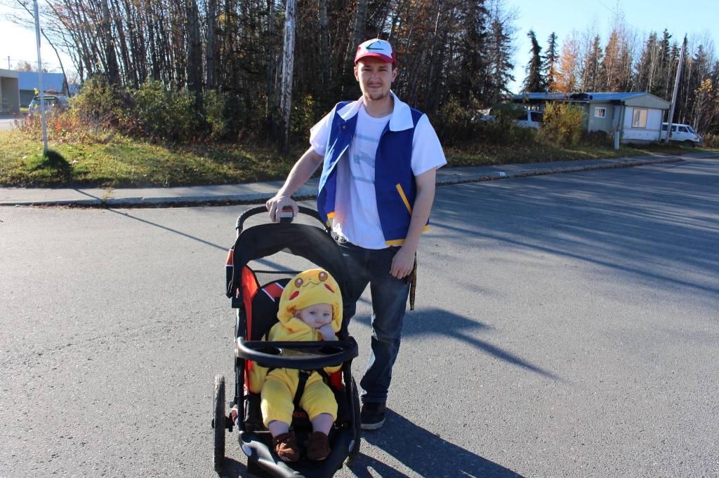 Andrew Billups and his son, Asher Billups, of Kenai, show off their costumes during the 5th annual Kenai Fall Pumpkin Festival in Kenai, Alaska on Oct. 10, 2020. (Photo by Brian Mazurek/Peninsula Clarion)