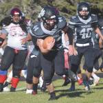 Nikiskis Koleman McCaughey rushes against Houston on Saturday, Oct. 10, 2020, at Nikiski High School in Nikiski, Alaska. (Photo by Jeff Helminiak/Peninsula Clarion)