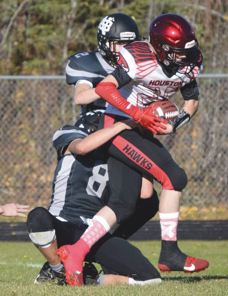 Nikiskis Simon Grenier and Holden Warnke stop Houstons Gordon Ratcliffe just short of the end zone with no time left in the first half Saturday, Oct. 10, 2020, at Nikiski High School in Nikiski, Alaska. (Photo by Jeff Helminiak/Peninsula Clarion)