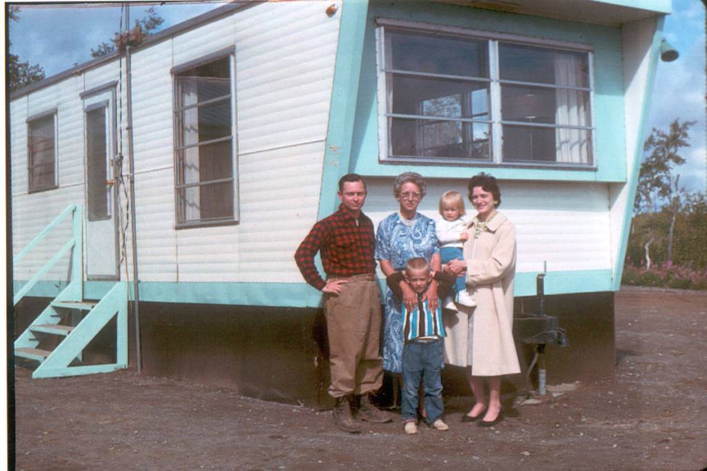 About a year after the Fairs moved onto their new homestead, they posed in front of their trailer for this photo. L-R, Calvin, his visiting mother Mary, Clark (age 5), Janeice (nearly age 2), and Jane. courtesy of the Fair Family Collection.