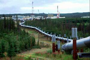 This undated file photo shows the Trans-Alaska pipeline and pump station north of Fairbanks, Alaska. (AP Photo/Al Grillo, File)FILE - This undated file photo shows the Trans-Alaska pipeline and pump station north of Fairbanks, Alaska. The future of Alaskas unique program of paying residents an annual check is in question, with oil prices low and an economy struggling during the coronavirus pandemic. (AP Photo/Al Grillo, File)