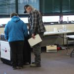 A poll worker helps a voter with his ballot at the Soldotna Regional Sports Complex on Tuesday, Nov. 3 in Soldotna, Alaska. (Photo by Ashlyn OHara/Peninsula Clarion)
