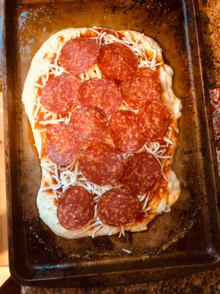 Pepperoni pizza ready to go into the oven, on Monday, Nov. 2, 2020, in Anchorage, Alaska. (Photo by Victoria Petersen/Peninsula Clarion)