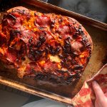 A little bit burnt, but this pizza turned out great, on Monday, Nov. 2, 2020, in Anchorage, Alaska. (Photo by Victoria Petersen/Peninsula Clarion).