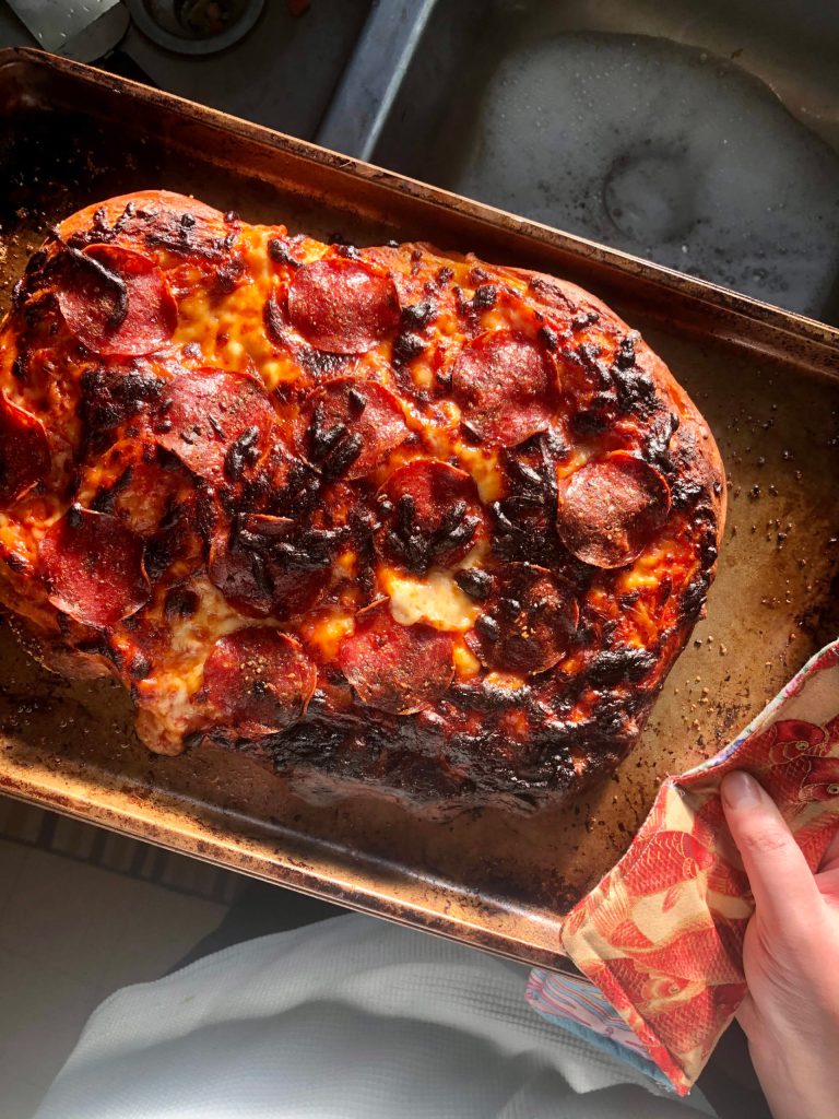 A little bit burnt, but this pizza turned out great, on Monday, Nov. 2, 2020, in Anchorage, Alaska. (Photo by Victoria Petersen/Peninsula Clarion).
