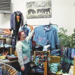 Brian Mazurek / Peninsula Clarion
Amy Kruse, owner of Love From Alaska, shows off some of her wares inside Cook Inletkeepers Community Action Studio in Soldotna on Thursday.