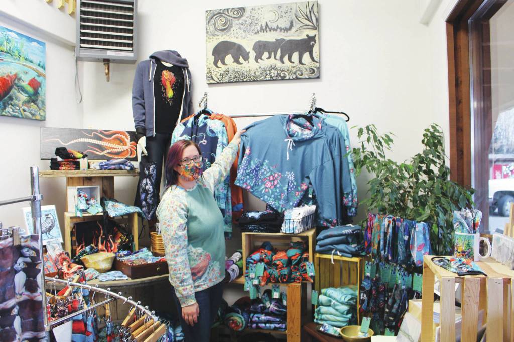 Brian Mazurek / Peninsula Clarion
Amy Kruse, owner of Love From Alaska, shows off some of her wares inside Cook Inletkeepers Community Action Studio in Soldotna on Thursday.