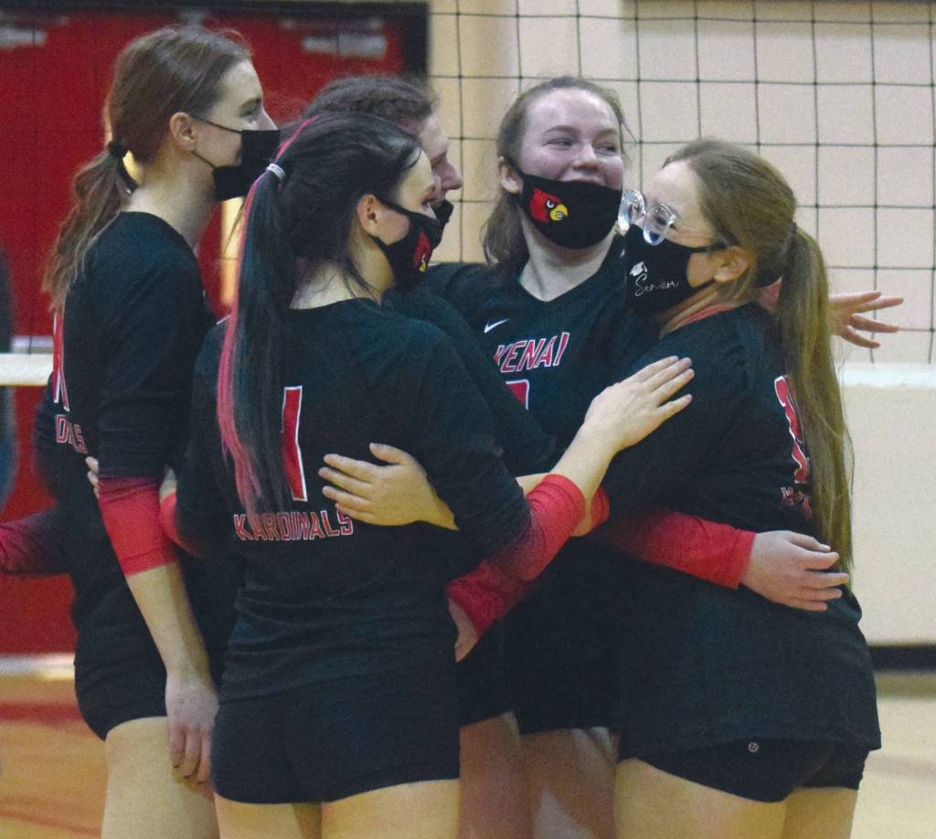 The Kenai Central volleyball team celebrates after winning the Kenai Peninsula Borough School District volleyball tournament Saturday, Nov. 7, 2020, at Kenai Central High School in Kenai, Alaska. (Photo by Jeff Helminiak/Peninsula Clarion)