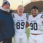 Soldotna High School head football coach Galen Brantley Jr. poses with former players Galen Brantley III and Aaron Faletoi. Brantley III and Faletoi helped Dickinson State in Dickinson, South Dakota, to an undefeated regular season. (Photo provided by Galen Brantley Jr.)