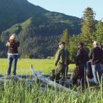 Visitors enjoy bear viewing in the saltmarsh at Chinitna Bay, Lake Clark National Park. (Photo by J. Pfeiffenberger/NPS)