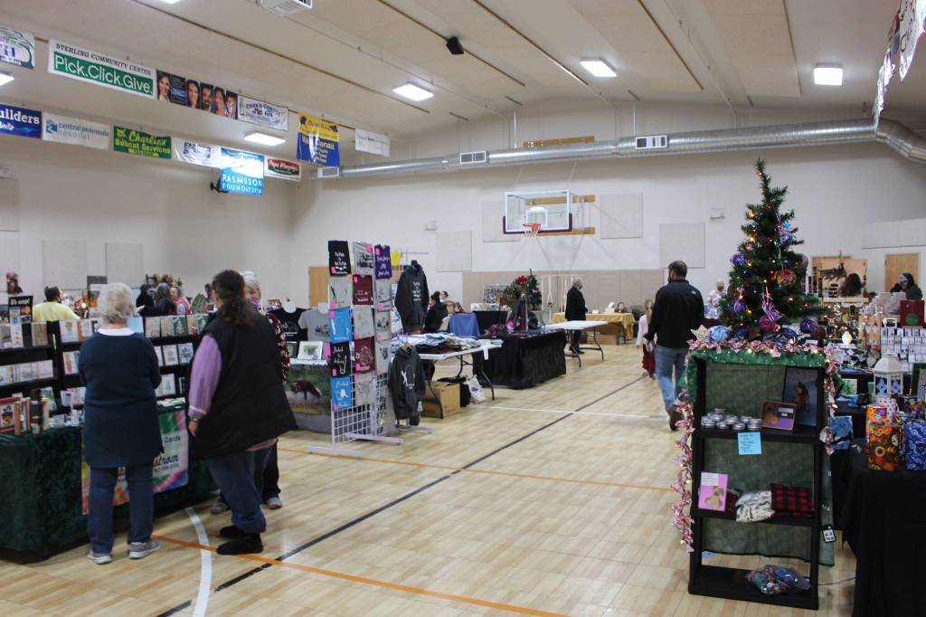 Shoppers browse the selection of locally made goods at the Sterling Fall Festival in Sterling, Alaska on Nov. 28, 2020. (Photo by Brian Mazurek/Peninsula Clarion)