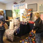 Brian Mazurek/Peninsula Clarion
Deray Jones, left, and Darla Jones, center, check out the cozy pillow loungers made by Becky Moore of Joyful Crafters, right, during the Sterling Fall Festival in Sterling, on Saturday.