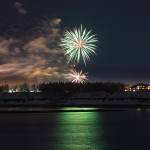 Fireworks can be seen across the Kenai River during the 2020 Christmas Comes to Kenai Parade on Nov. 27, 2020. (Photo courtesy Brittany Brown/Kenai Chamber of Commerce)