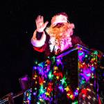 Santa Claus waves to the crowd atop a City of Kenai fire truck during the 2020 Christmas Comes to Kenai Parade in Kenai, Alaska on Nov. 27, 2020. (Photo courtesy Brittany Brown/Kenai Chamber of Commerce).