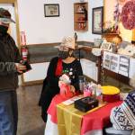 Brian Mazurek/Peninsula Clarion 
Bob Mohni, of Cooper Landing, buys door prize tickets from Cheryle James, High Priestess of the Lady Shriners of Alaska, during the inaugural Lady Shriners Craft Fair at the Kenai Soldotna Shrine Club on Saturday.