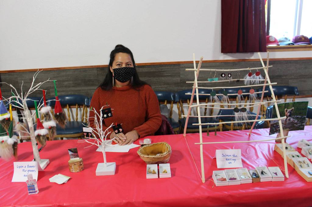 Michelle Ravenmoon of Soldotna, owner of Ravenmoon Denaina Art, displays some of her wares during the inaugural Lady Shriners Craft Far at the Kenai Soldotna Shrine Club in Soldotna, Alaska on Dec. 5, 2020. (Photo by Brian Mazurek/Peninsula Clarion)