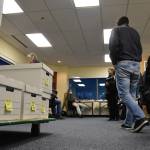 Divisions of Elections staff and members of the State Review Board get ready to recount ballots from Anchorages House District 27 at the DOE directors office in Juneau on Friday, Dec. 4, 2020. (Peter Segall / Juneau Empire)