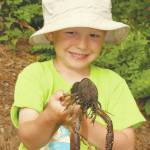 Wyatt, at age 4, helping dad harvest crawfish at White River NWR in Arkansas. (Photo by Matt Conner/USFWS)