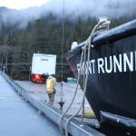 A truck backs up onto a Haines-bound boat on Dec. 3, 2020, as part of an effort to send supplies and people to the landslide-afflicted community. (Ben Hohenstatt / Juneau Empire)