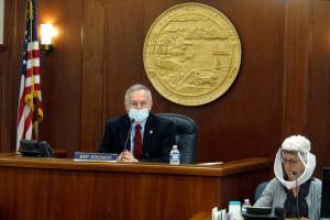 In this May 19, 2020, file photo, Alaska House Speaker Bryce Edgmon, left, presides over the House floor in Juneau, Alaska. Alaska lawmakers who each year relocate to a capital city accessible only by plane or boat are facing challenges in getting settled ahead of what is expected to be a difficult legislative session overshadowed by COVID-19. Speaker Edgmon, an independent from Dillingham, about 860 miles from Juneau, said pandemic concerns come at a time when lawmakers will need to make tough budget decisions. (AP Photo/Becky Bohrer, File)