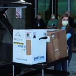 Ashlyn OHara / Peninsula Clarion
Central Peninsula Hospital Pharmacy Technician Jessica Hulet rolls a cart carrying doses of Pfizers COVID-19 vaccine into Central Peninsula Hospital in Soldotna on Wednesday.